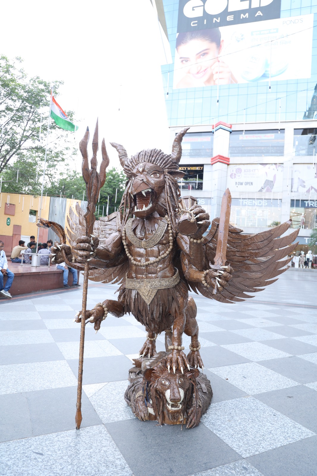 Alternate full frontal daylight view of the monumental corrugated cardboard sculpture Narasimha by Mukul Thakur.